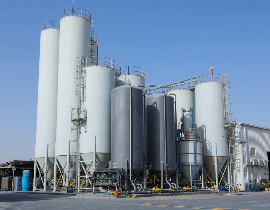 A view of white cementing tankers at the Superior Cementing Kuwait facility