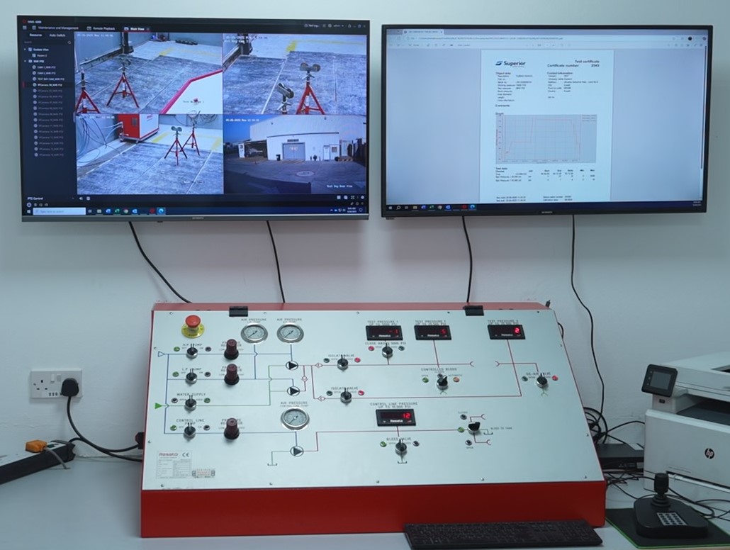 A pressure testing console hooked up to two monitors at Superior Cementing's Kuwait facility